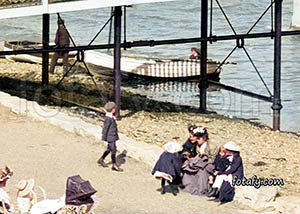 An old Warrenpoint photo that has been restored, HD enhanced and colourised of a family enjoying the sea front near the swimming baths