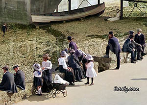 An old image that has been fully restored, colourised and HD enhanced of crowds on the promenade in Warrenpoint enjoying the sea air and sunshine