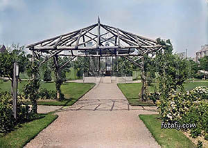 An old image of a timber gazebo at the Municipal Gardens in Warrenpoint. The image has been fully restored, HD enhanced and colourised.