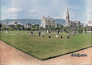 A victorian image of the Municipal gardens with St Peter's church in Warrenpoint. The image has been restored, HD enhanced and colourised.