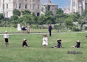 An old image of children posing for the camera in the Municipal Gardens in Warrenpoint. The images has been fully restored, HD enhanced and colourised.