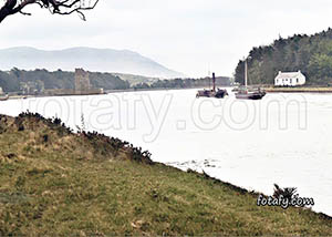 An old image of steam boats passing Narrow Water castle. The image has been fully restored and colourised. 