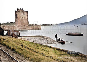 A Victorian era image of Narrow Water Castle, the old railway lines and a rowing boat ready to cross the river. The image has been fully restored, HD enhanced and colourised.