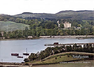 An old image that has been fully restored and colourised of Narrow Water Castle with the Mourne mountains in the background.