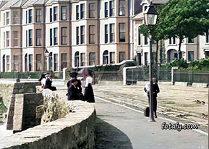 An old image of the sea walls and promenade in Warrenpoint. The image has been fully restored, colourised and HD Enhanced.