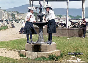 An old image that has been fully restored, colourised and HD enhanced of girls at the promenade fountain, Warrenpoint 