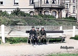 An old image of three boys enjoying the sunshine at the promenade in Warrenpoint. The image has been restored, colouried and HD enhanced.