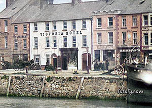 An old image of the Victoria Hotel at the quays in Warrenpoint. The image has been fully restored, HD enhanced and colourised