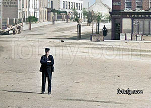 An early 1900s image of an old man posing in the Square in Warrenpoint. The image has been restored, HD enhanced and colourised.