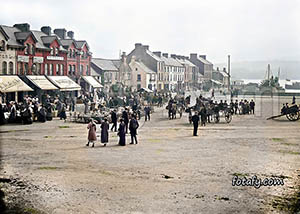 A Victorian era image of Newells shops during market day in Warrenpoint Square. This image has been fully restored, colourised and HD enhanced